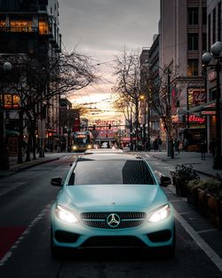 Car on city street at dusk