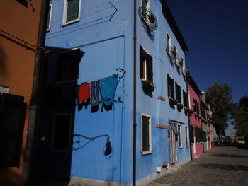 Low angle view of clothes drying on building