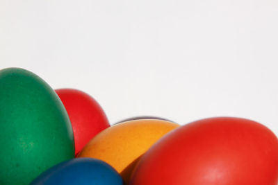 Close-up of multi colored candies against white background