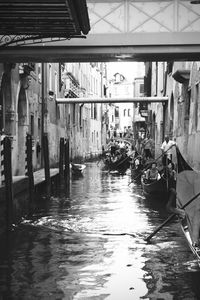 Canal amidst buildings in city