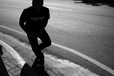 Woman standing on road