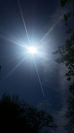 Low angle view of vapor trails in sky