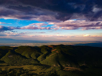 Scenic view of landscape against sky during sunset