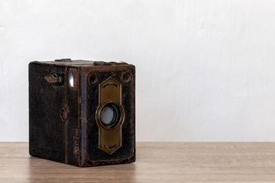 Close-up of camera on table