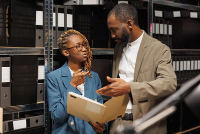 Side view of business colleagues working in office