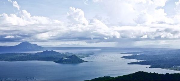 Scenic view of mountains against cloudy sky