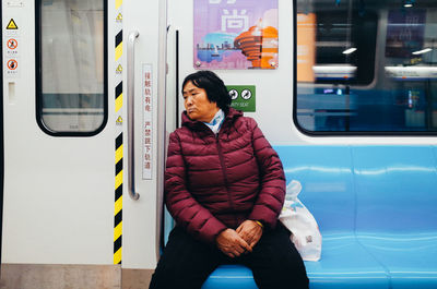 Portrait of woman looking at train