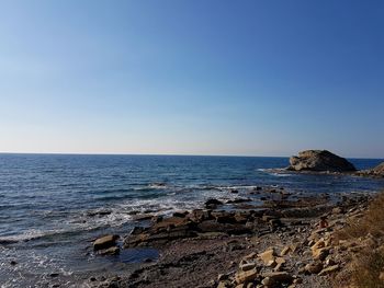 Scenic view of sea against clear sky