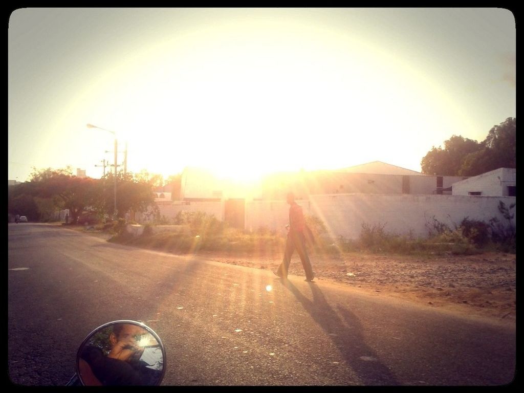 transfer print, sun, sunbeam, sunlight, auto post production filter, lens flare, sunset, transportation, lifestyles, sky, road, leisure activity, men, street, car, land vehicle, silhouette, tree