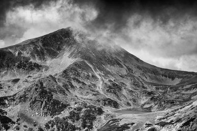 Scenic view of volcanic mountain against sky