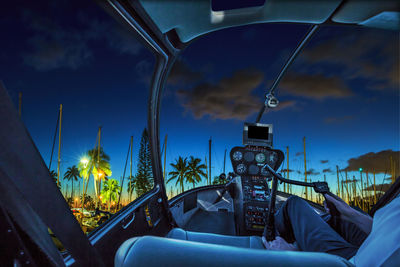 Panoramic view of car against sky seen through windshield