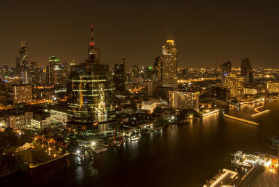 Illuminated buildings in city at night