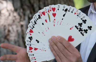 Close-up of hand holding umbrella