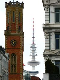 Low angle view of clock tower against sky