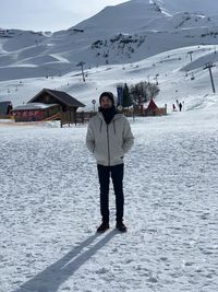 Full length of man on snow covered mountain