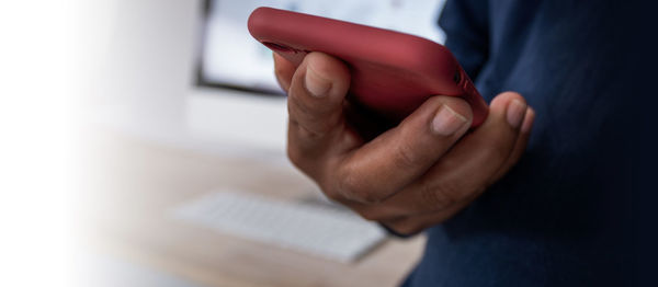 Close-up of hand holding smart phone