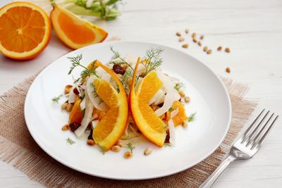 High angle view of orange slices in plate on table