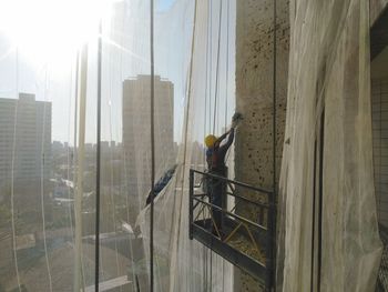 Man working at construction site in city