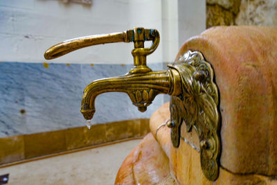 Close-up of faucet on wall