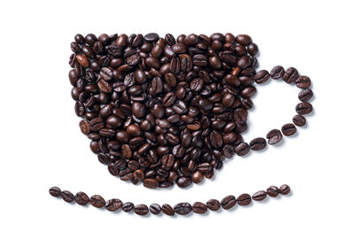 Directly above shot of coffee beans on white background