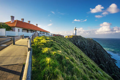 Scenic view of sea and buildings against sky