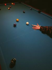 Person playing with ball on table