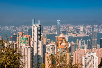 Aerial view of modern buildings in city against sky