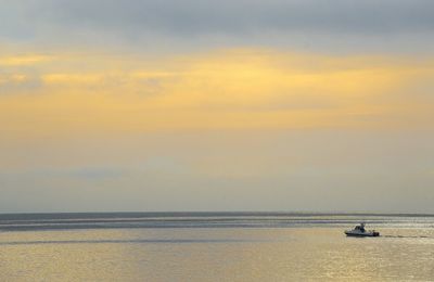 Scenic view of sea at sunset