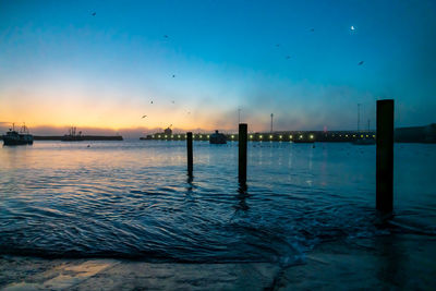 Scenic view of sea against sky at sunset