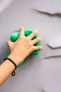 Close-up of hand holding grip on wall