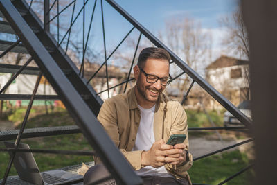 Young man using mobile phone