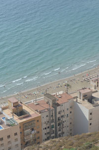 High angle view of buildings by sea