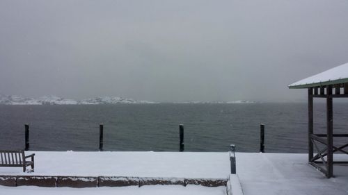 Pier on sea against sky