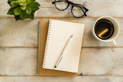 High angle view of coffee cup on table