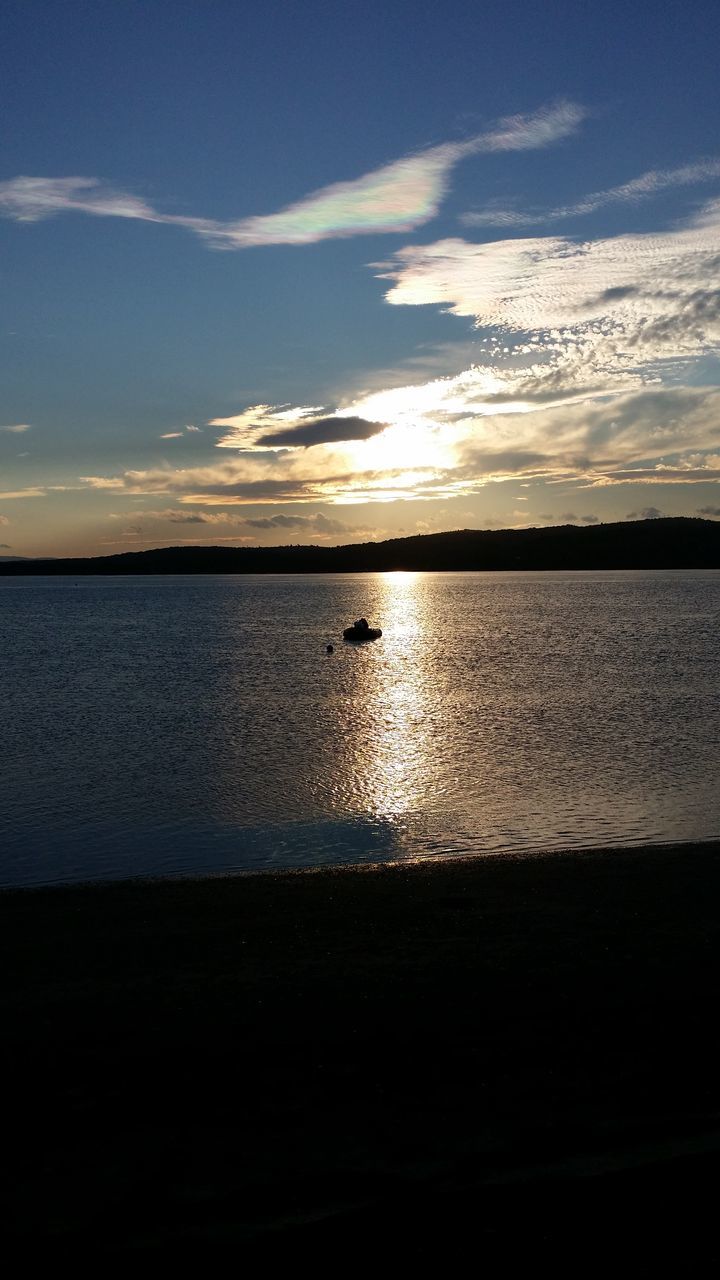 light, reflection, sunlight, darkness, nature, water, sky, blue, no people, outdoors, sea, beauty in nature, day, cloud, lighting
