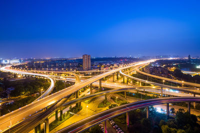 High angle view of light trails on highway at night