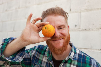 Portrait of man holding ice cream