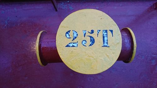 High angle view of information sign on metal wall