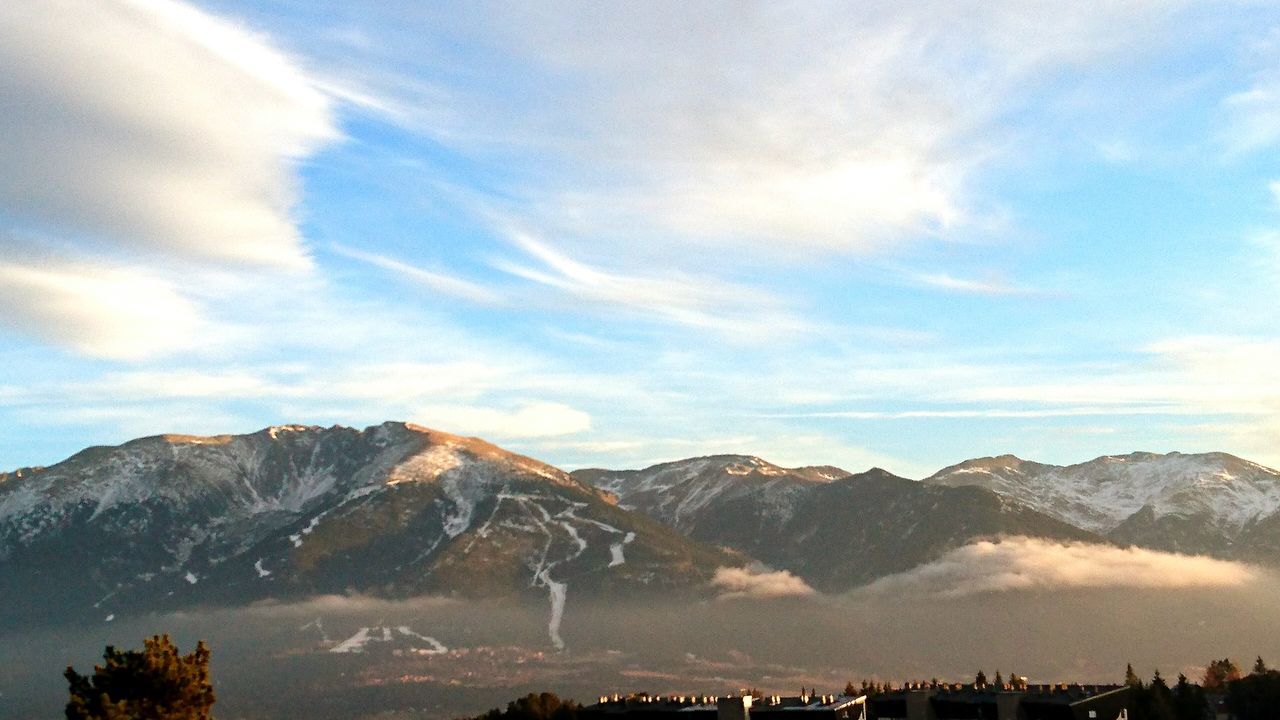 mountain, mountain range, scenics, tranquil scene, beauty in nature, tranquility, sky, cloud - sky, nature, landscape, snowcapped mountain, idyllic, non-urban scene, tourism, physical geography, travel destinations, famous place, cloud, day, mountain peak