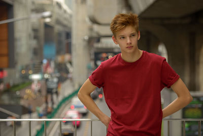Portrait of teenage boy standing outdoors