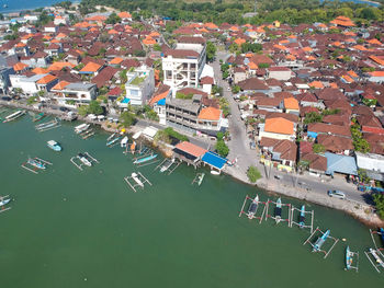 High angle view of buildings, boats and sea