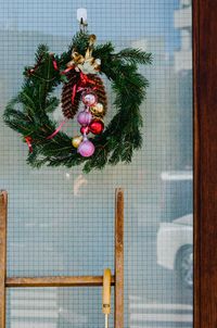 Close-up of christmas decorations hanging on tree