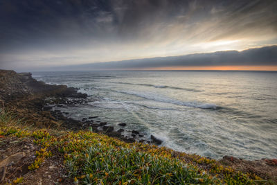 Scenic view of sea against sky during sunset