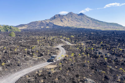 Scenic view of volcanic landscape against sky