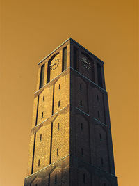 Low angle view of building against sky during sunset