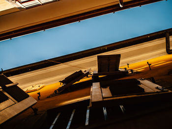 Low angle view of building against clear blue sky