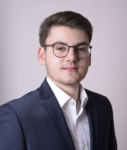 Portrait of smiling mid adult man against white background