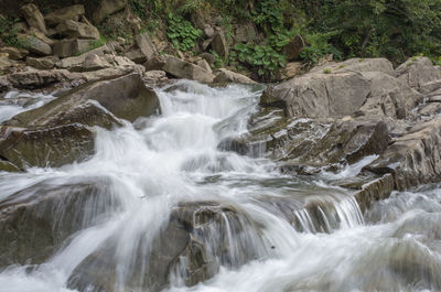 Scenic view of waterfall at sea