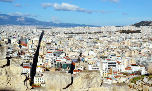 View of town against cloudy sky