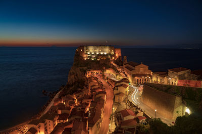 High angle view of illuminated buildings at night